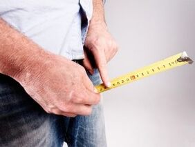 the man measures the length of the penis before enlarging the soda
