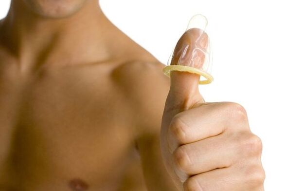 a condom on a finger symbolizes the enlargement of a teenager’s penis