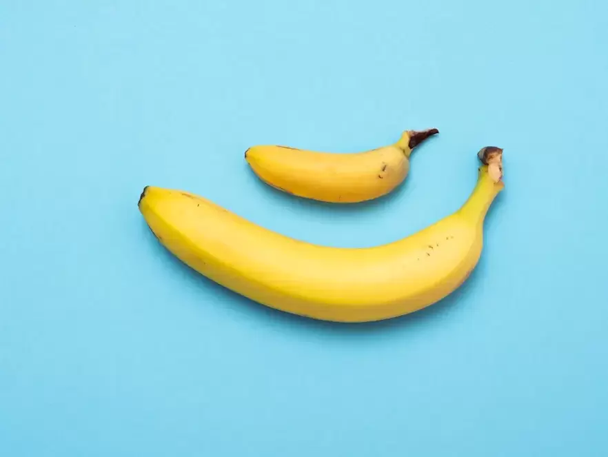 a small and enlarged penis with pomp on the example of a banana